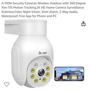 Brand new in box black security camera and 33 ft extension cord.